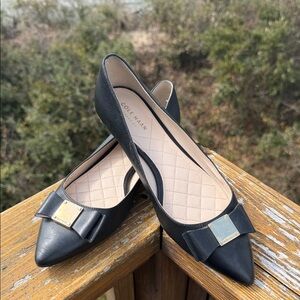 Cole Haan Black Pointed Toe Bow Flats with Gold Accent